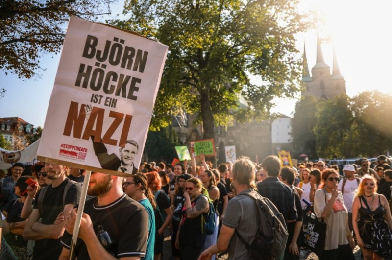 Demonstrators in Efert in Thuringia, in the former East Germany, mount a counter-protest at a AfD election rally a day before September 1 elections for the state parliament. The sign accuses the chair of the AfD in Thuringia, Bjorn Hocke, of being "a Nazi." File photo by Clemens Bilan/EPA-EFE