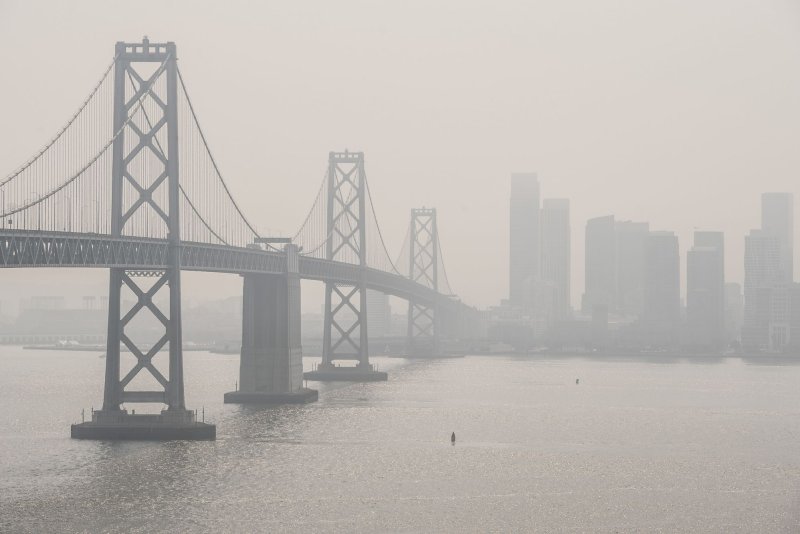 Smoke from fires in northern California lowers visibility of the Bay Bridge and San Francisco as viewed from Yerba Buena Island on Oct. 2, 2020. File Photo by Terry Schmitt/UPI